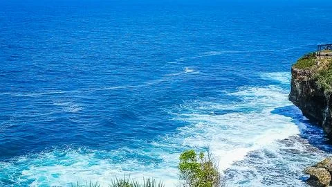 Breathtaking Ocean Cliffside View With Waves Crashing Below Stock Photos