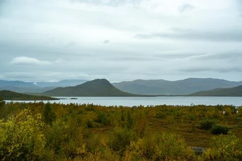 A breathtaking panoramic view of an expansive Nordic landscape, featuring a t Stock Photos