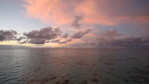 Breathtaking pink sunset tranquil ocean, Moorea French Polynesia Stock Footage 102149733