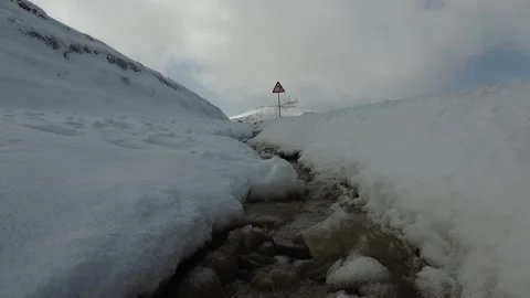 A breathtaking range of snow capped mountains stretches, stock footage. Stock Footage 304867088