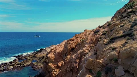 Breathtaking Rocky Shoreline and Deep Blue Ocean View in Cabo San Lucas, Mexico Stock Footage 297123793