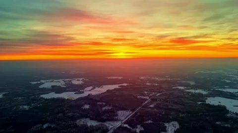 Breathtaking Scene Of The Evening Sky Over Winter Rural Nature. Aerial Wide Shot Stock Footage 303958592