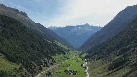 A breathtaking scenery of a valley between the high mountains in Switzerland. Stock Footage 249977304