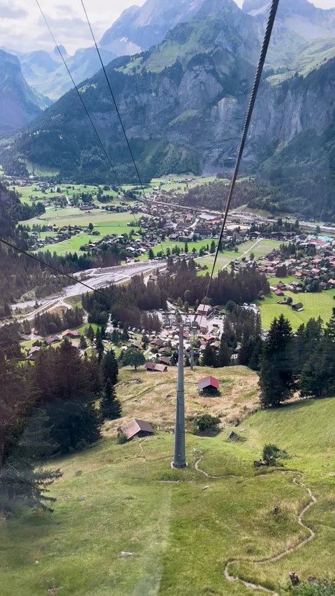 Breathtaking Scenic Cable Car View Over Lush Green Valley and Surrounding Stock Footage 307488329