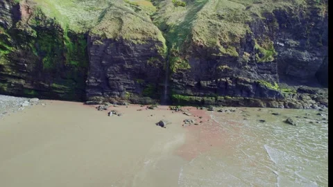Breathtaking Scenic Coastal Views featuring majestic Cliffs and a Sandy Beach Stock Footage 320799792