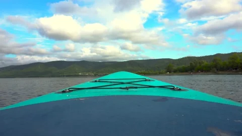 Breathtaking scenic view from a sup board gliding across tranquil waters Vidéo 282104917