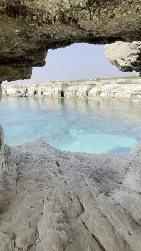 Breathtaking seaside view through a natural rock arch Stock Footage 280562175