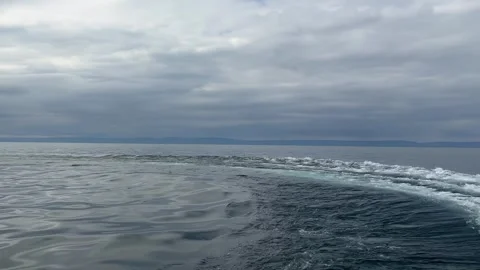 A breathtaking shot capturing waves radiating from a speedboat. View from the Stock Footage 326331286