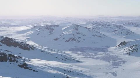 A breathtaking snowy mountain range seen from a plane Stock Illustration