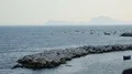 Breathtaking stony coastline and seascape with boats floating on water, vacation HD Footage