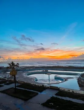 Breathtaking Sunset Bathes Infinity Pool in Golden Light Stock Photos