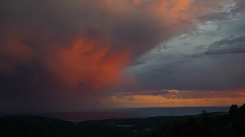 Breathtaking Sunset: Orange Clouds Drift Towards the Sea in a Symphony of Dusk Stock Footage 261235875