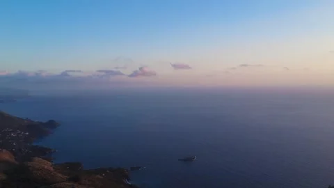 Breathtaking Sunset Over Calm Ocean Waters at a Remote Coastal Location Stock Footage 318388440