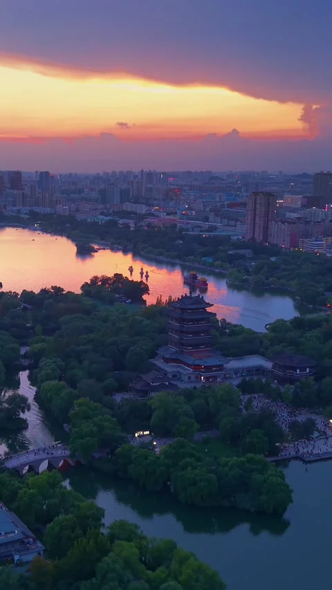 Breathtaking Sunset over Jinan's Daming Lake &amp; Chaoran Tower Stock Footage 331121266