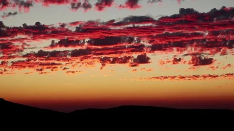 A breathtaking sunset scene where its glow reflects on the clouds Stock Footage 300586257