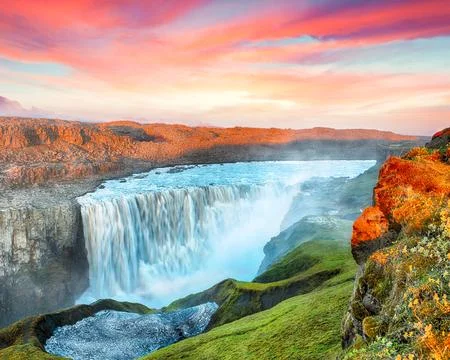 Breathtaking sunset view of the most powerful waterfall in Europe called De.. Stock Photos
