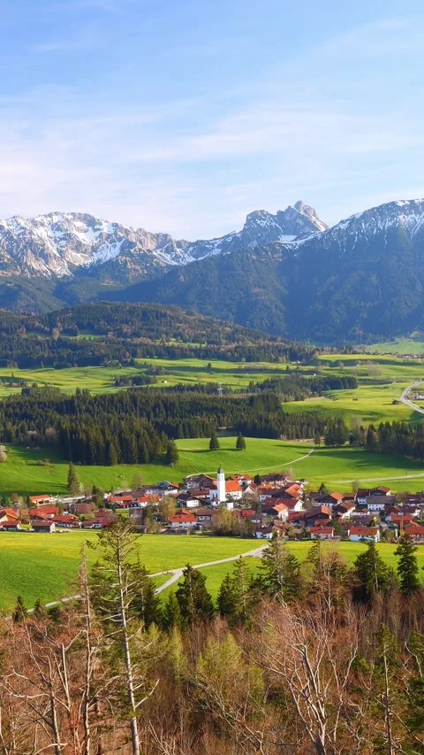 A breathtaking timelapse of flowing clouds, distant mountain peaks, and expan Stock Footage 309228066