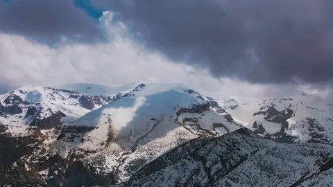 Breathtaking timelapse stormy clouds over the mountain peaks shot 4K drone Stock Footage 240601727