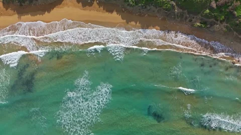 Breathtaking top-down drone view of Riviera Beach at Għajn Tuffieħa, Malta with Stock Footage 330833398
