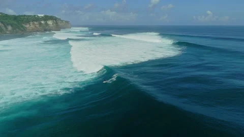 Breathtaking Top Down Shot Surfer Paddling Lineup Uluwatu 4K Stock Footage 341417084
