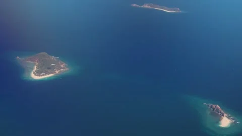 Breathtaking travel video of tropical islands from plane window with blue water Video stock 282906341