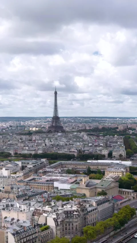 A breathtaking vertical aerial drone shot captures the Eiffel Tower rising Stock Footage 328293697