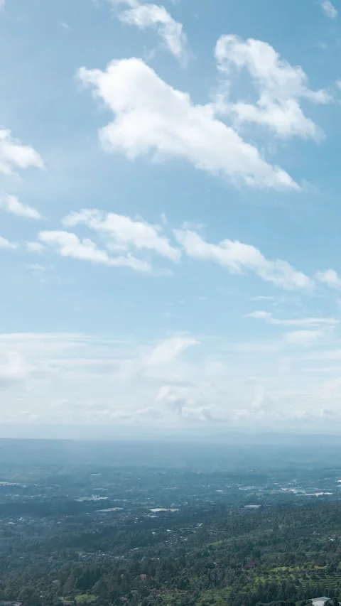 A breathtaking vertical drone shot capturing the beauty of drifting clouds Stock Footage 304254672