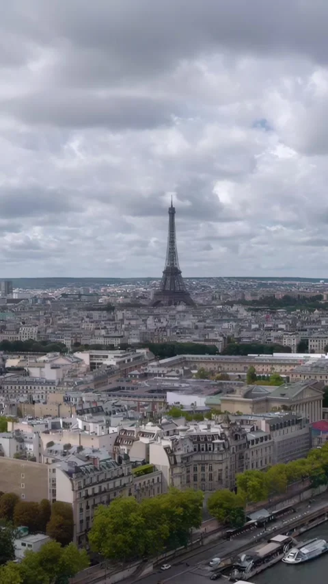 A breathtaking vertical steady aerial drone shot captures the Eiffel Tower Stock Footage 328296071