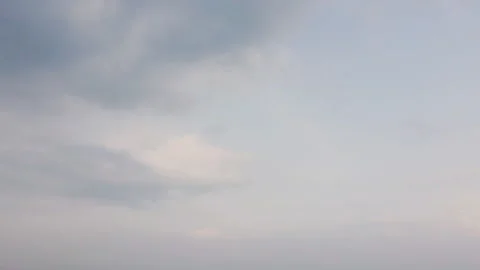 A breathtaking vertical timelapse of white clouds drifting smoothly Stock Footage 303473183