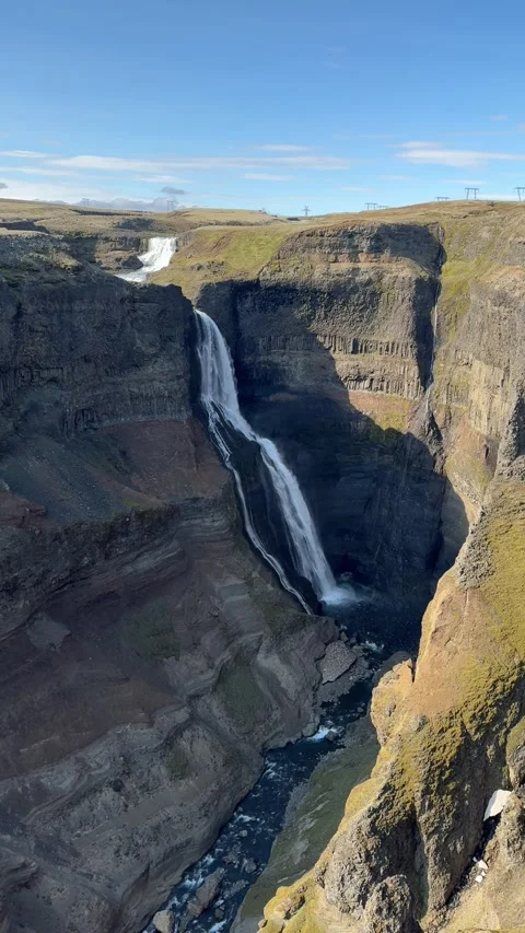 Breathtaking view from above of Haifoss waterfall plunging into the deep canyon, Stock Footage 331513766