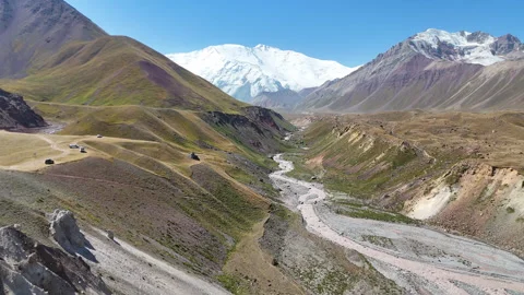 Breathtaking view of the Alay Valley and Lenin Peak under a clear sky. Stock Footage 321396905