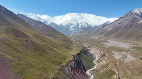 Breathtaking view of the Alay Valley and Lenin Peak under a clear sky. Stock Footage 321397209