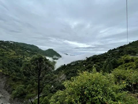 A Breathtaking View of a Cloud-Covered Mountain Valley in Dehradun Stock Photos