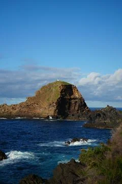 A breathtaking view of a dramatic volcanic sea stack rising vertically Stock Photos