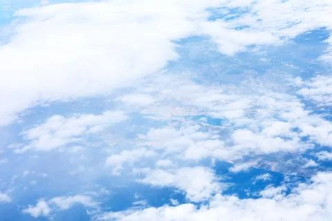 Breathtaking view of fluffy white clouds floating across sky Stock Photos