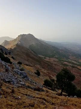 A breathtaking view of the high mountain range, its towering peaks rising Stock Photos