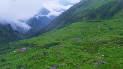 A breathtaking view of lush green mountain valleys covered in fresh grass Video stock 316282912