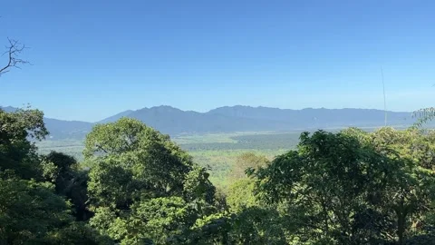 Breathtaking View of Lush Valley with Mountain Range Stock Footage 335176740
