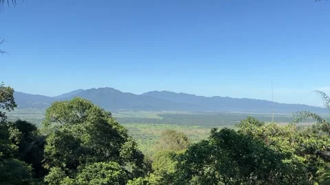 Breathtaking View of Lush Valley with Mountain Range Stock Footage 335176746