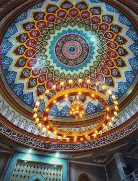 A breathtaking view of a mosque's ornate dome.  Intricate calligraphy and vib Stock Photos