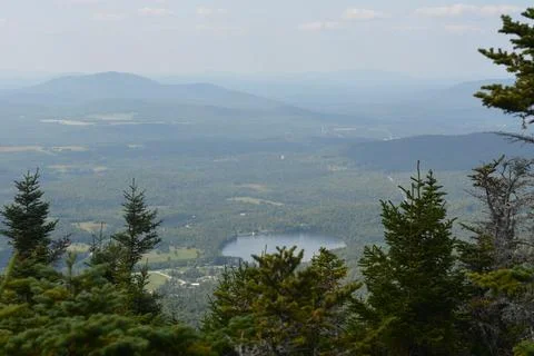 Breathtaking View From a Mountain Summit Overlooking a Tranquil Lake Stock Photos