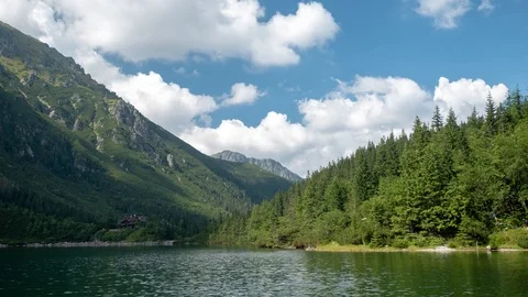 Breathtaking view with mountains, lakes and green field. Time Lapse Stock Footage 93476089
