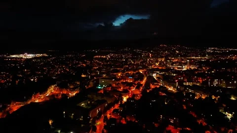 A breathtaking view of a night cityscape featuring illuminated streets and Stock Footage 318630086