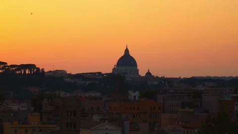 A breathtaking view of Rome as the sun sets, illuminating the skyline with Stock Footage 284561189