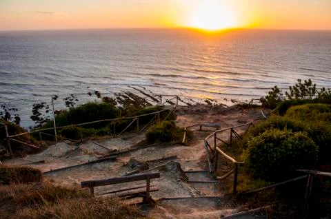 Breathtaking view of the sea with dramatic sunset, seen from a lovely and rustic Stock Photos