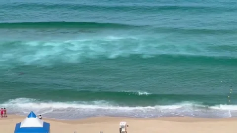 A breathtaking view of the sea with gentle waves and a serene horizon. A ca.. Video stock 318998076
