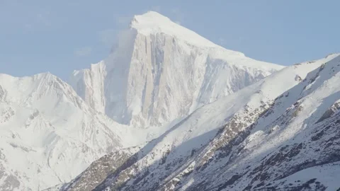 A breathtaking view of a snow-capped mountain in the Karakoram Range, Pakistan 스톡 동영상 314454909