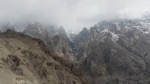 A breathtaking view of snow-capped mountains in Pakistan, captured under an 스톡 동영상 317958105