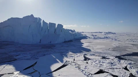 Breathtaking view of a snow-covered mountain range under a partly cloudy sky. Stock Footage 297847618