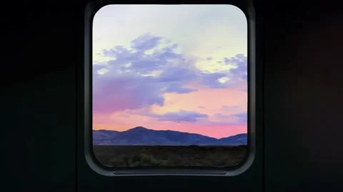 Breathtaking view of sunset with mountain through a big window in the train. 動画素材 146194998